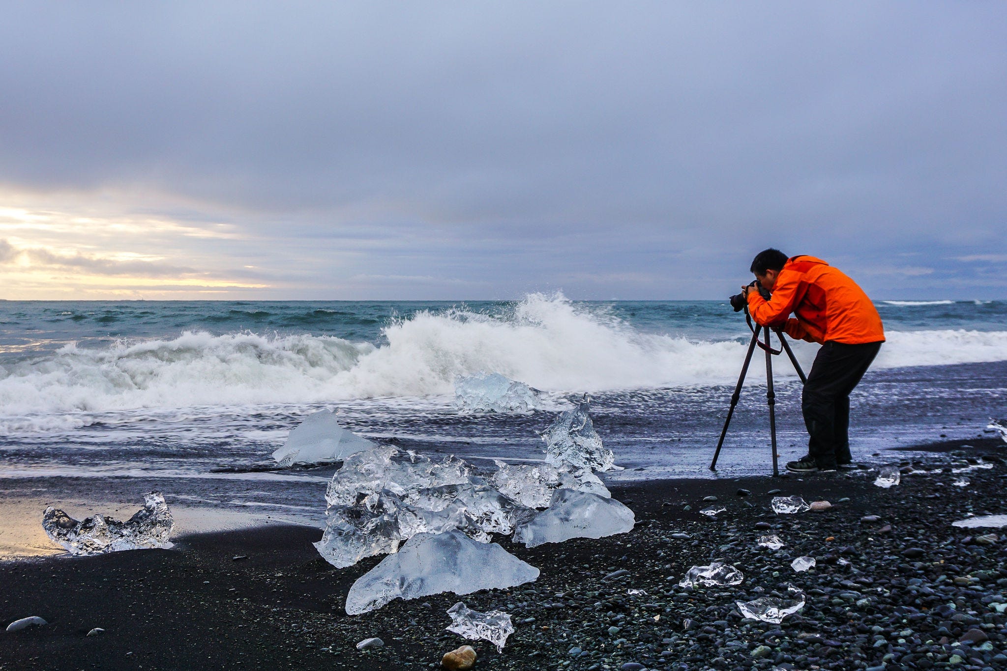 Man photographer at Jokulsarlon glacier lake lagoon. Vatnajokull National Park. Iceland.; Shutterstock ID 1008006835; NP: OECD.org