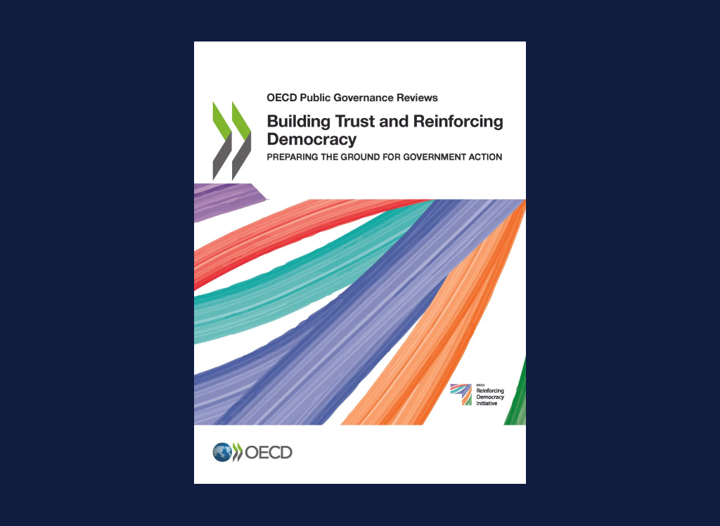Building trust and reinforcing mocracy report cover with title, OECD logo and multicolored paint strokes